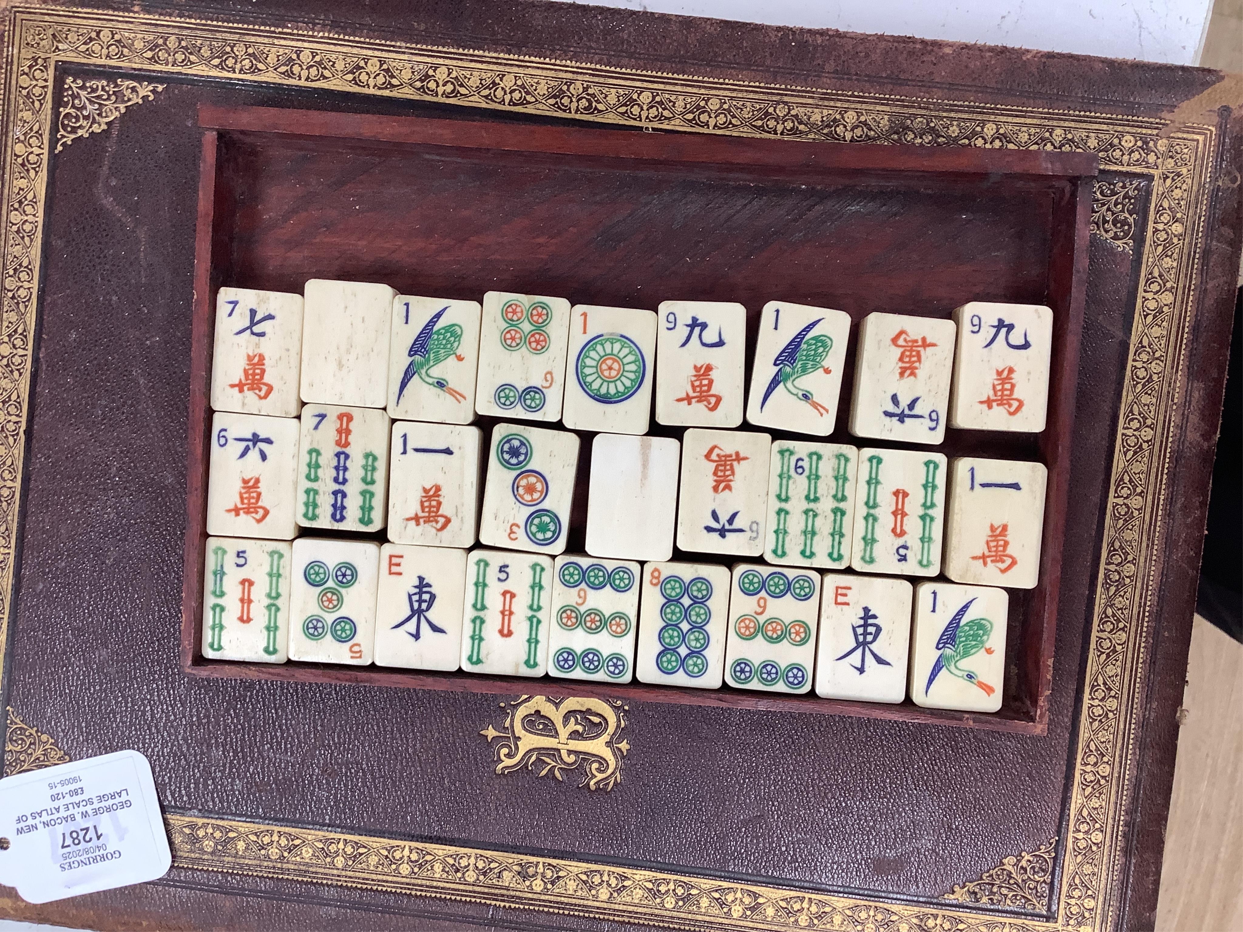 A cased Chinese mahjong set, bone pieces